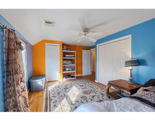 11 Partridge Road Dracut, MA 01826 - Photo 14 of 40 a bedroom with a bed and a television