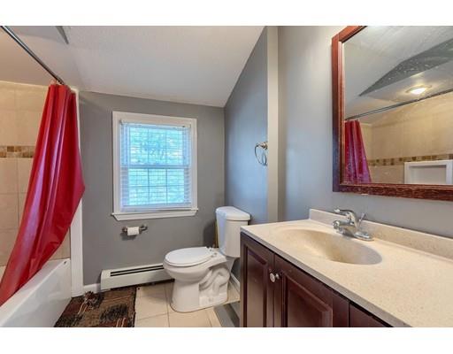 11 Partridge Road Dracut, MA 01826 - Photo 17 of 40 a bathroom with a sink and a mirror