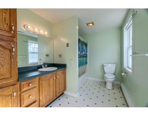 11 Partridge Road Dracut, MA 01826 - Photo 18 of 40 a bathroom with a sink a toilet and shower