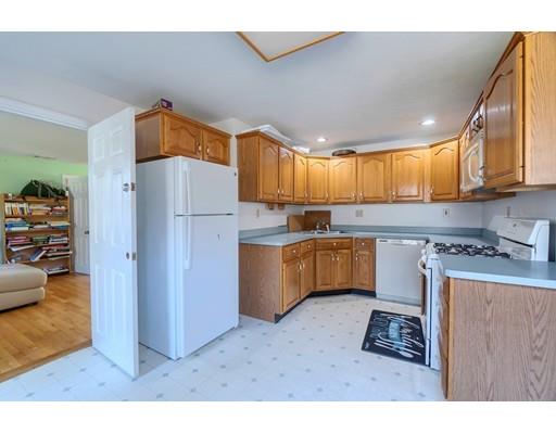 11 Partridge Road Dracut, MA 01826 - Photo 20 of 40 a kitchen with stainless steel appliances granite countertop a refrigerator a stove a sink and a cabinets