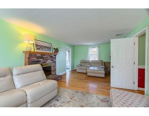 11 Partridge Road Dracut, MA 01826 - Photo 24 of 40 a living room with furniture and a fireplace
