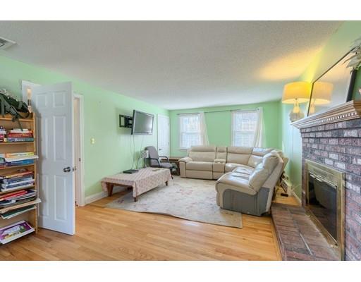 11 Partridge Road Dracut, MA 01826 - Photo 25 of 40 a living room with furniture and a fireplace