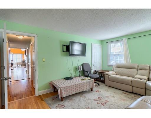 11 Partridge Road Dracut, MA 01826 - Photo 26 of 40 a living room with furniture and a flat screen tv