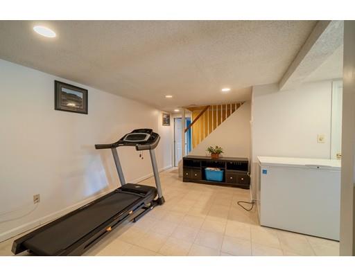 11 Partridge Road Dracut, MA 01826 - Photo 34 of 40 a living room with furniture and a flat screen tv