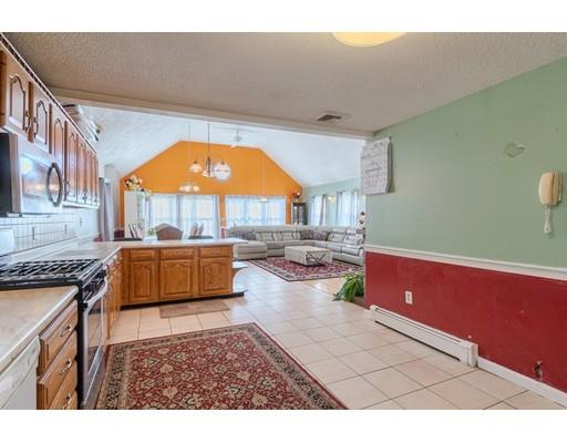 11 Partridge Road Dracut, MA 01826 - Photo 5 of 40 a living room with furniture a rug and a fireplace