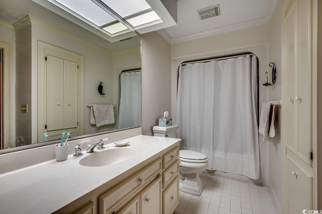 12 Chapin Circle Myrtle Beach, SC 29572 - Photo 26 of 39 Bathroom featuring visible vents, toilet, ornamental molding, tile patterned floors, and vanity