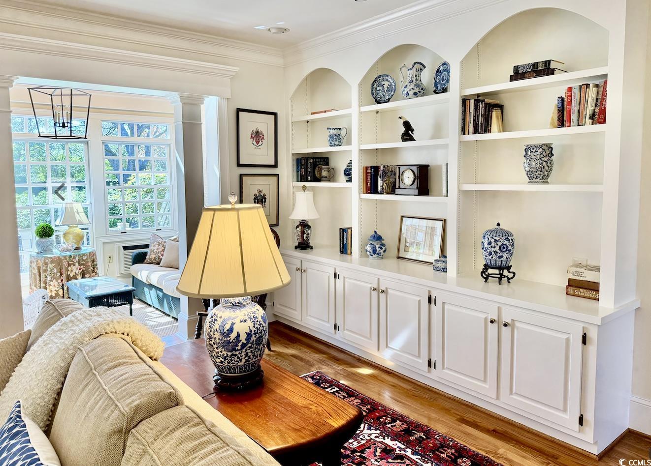 12 Chapin Circle Myrtle Beach, SC 29572 - Photo 35 of 39 Sitting room with decorative columns, crown molding, built in shelves, and light wood-type flooring
