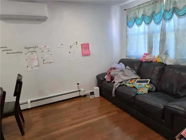 a bedroom with a bed and a chair