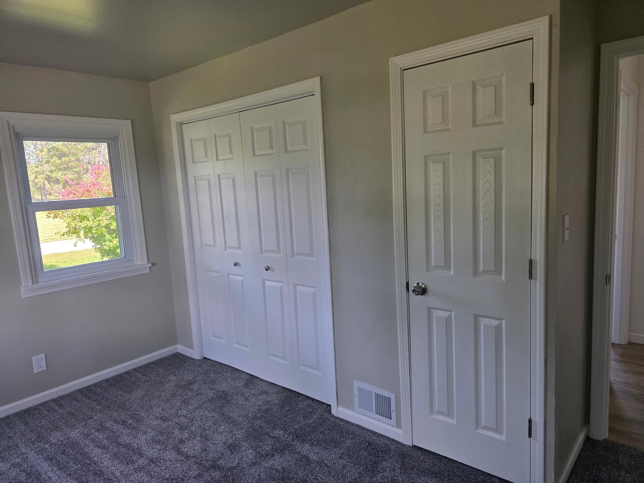704 Spruce Street Savanna, IL 61074 - Photo 11 of 19 a view of an entryway with wooden floor