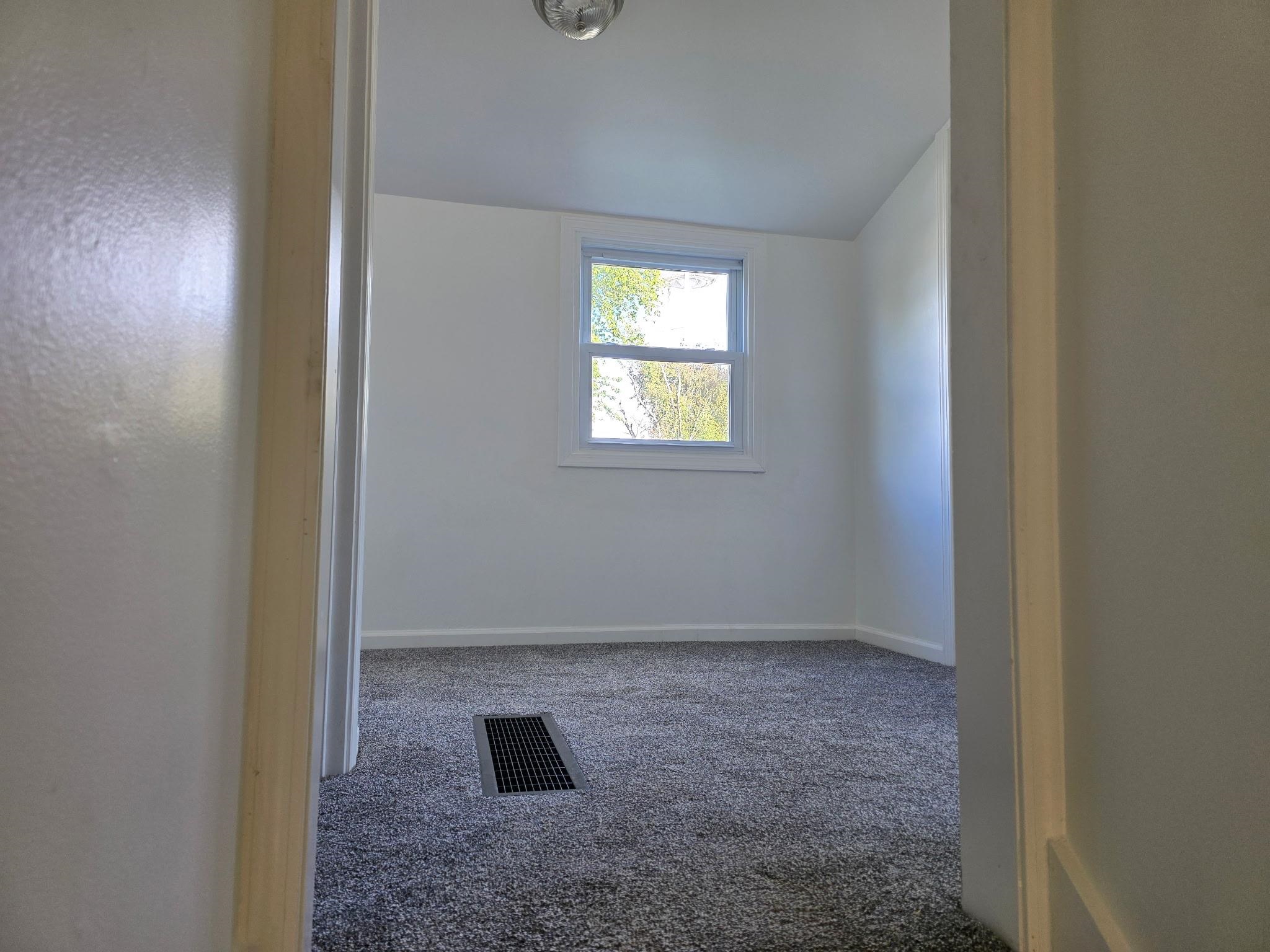 704 Spruce Street Savanna, IL 61074 - Photo 12 of 19 an empty room with a window