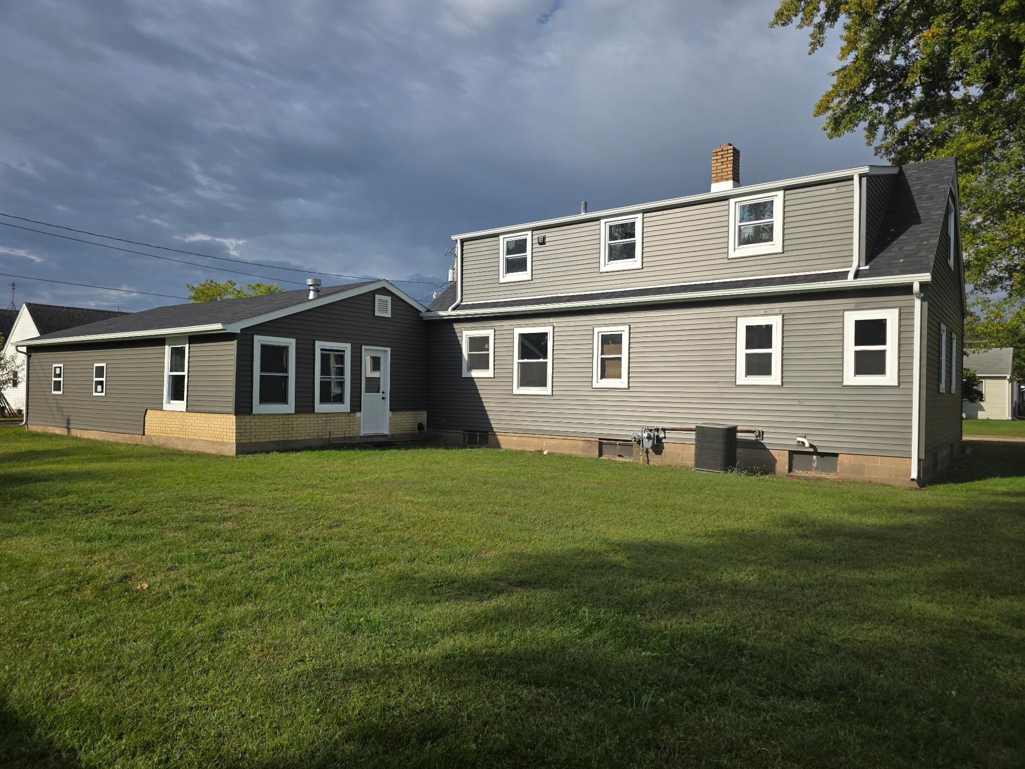704 Spruce Street Savanna, IL 61074 - Photo 2 of 19 a front view of a house with a garden
