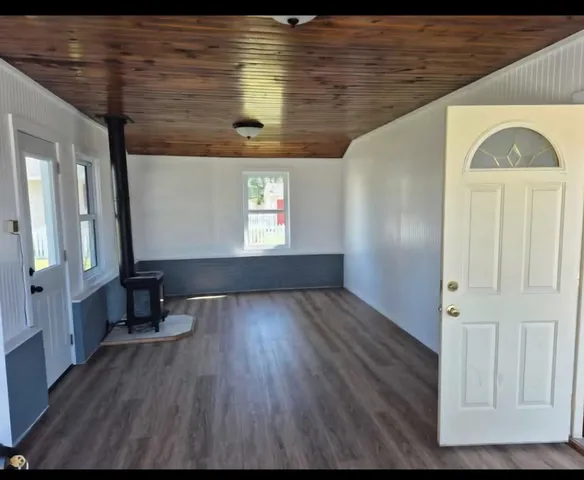 a view of front door and wooden floor