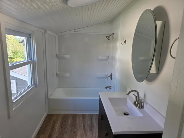 a bathroom with a sink a toilet and a bathtub