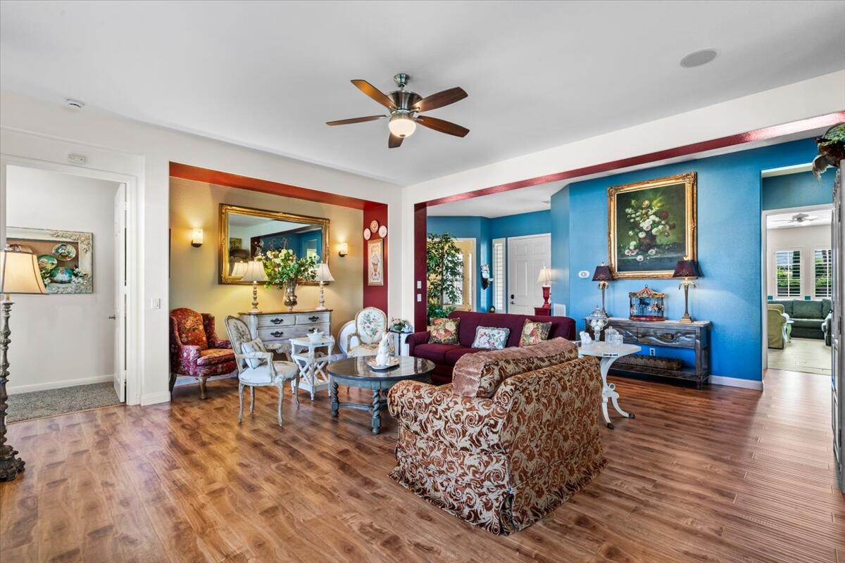 81836 Bowstring Circle La Quinta, CA 92253 - Photo 11 of 56 a living room with furniture and a wooden floor