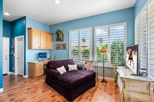 a kitchen with stainless steel appliances granite countertop a sink a stove and a microwave