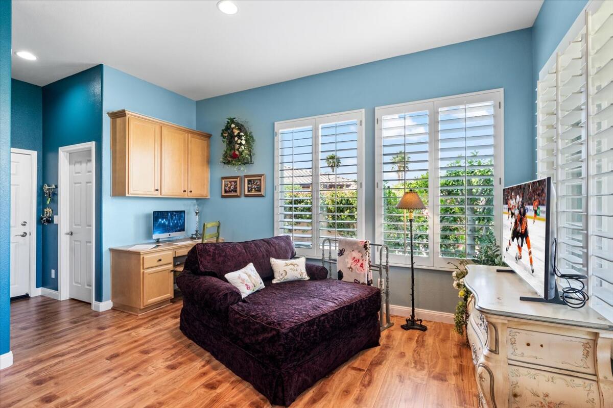81836 Bowstring Circle La Quinta, CA 92253 - Photo 11 of 55 a living room with furniture and a flat screen tv