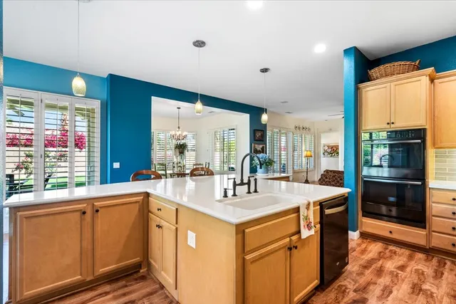 a living room with furniture and flowers