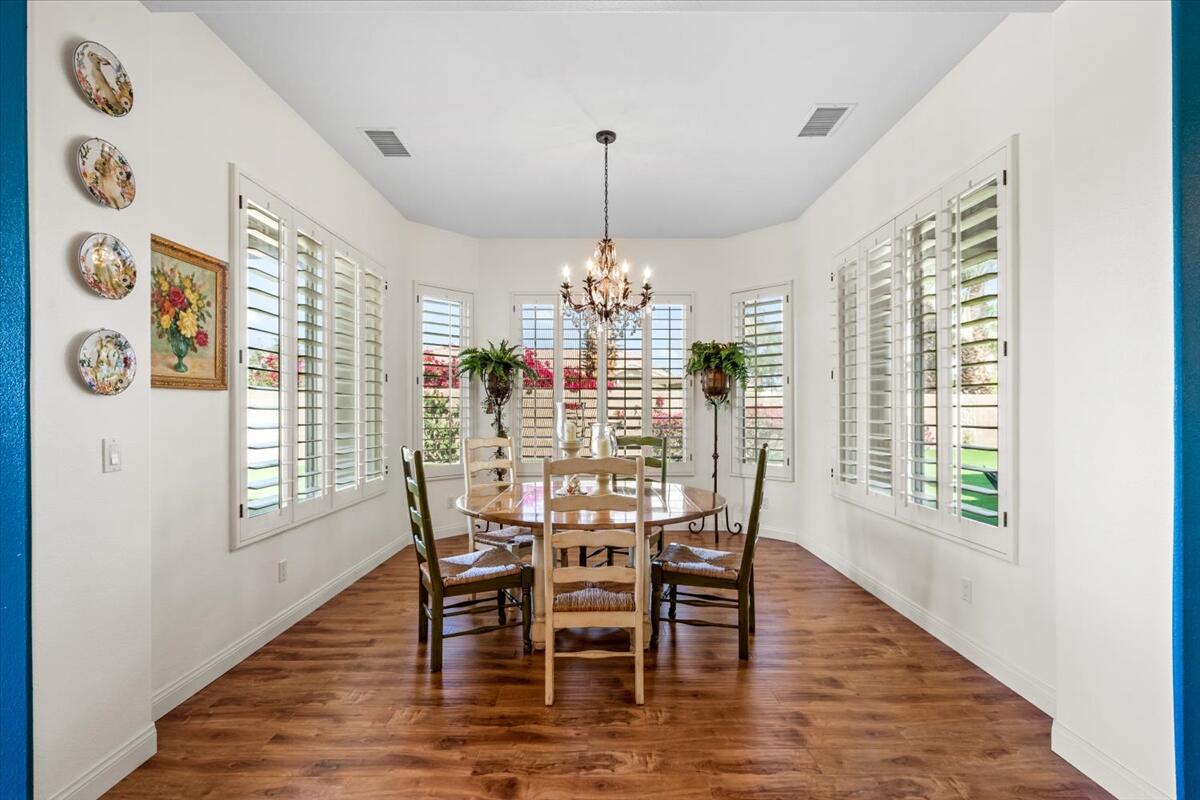 81836 Bowstring Circle La Quinta, CA 92253 - Photo 17 of 55 a dining room with furniture window and wooden floor