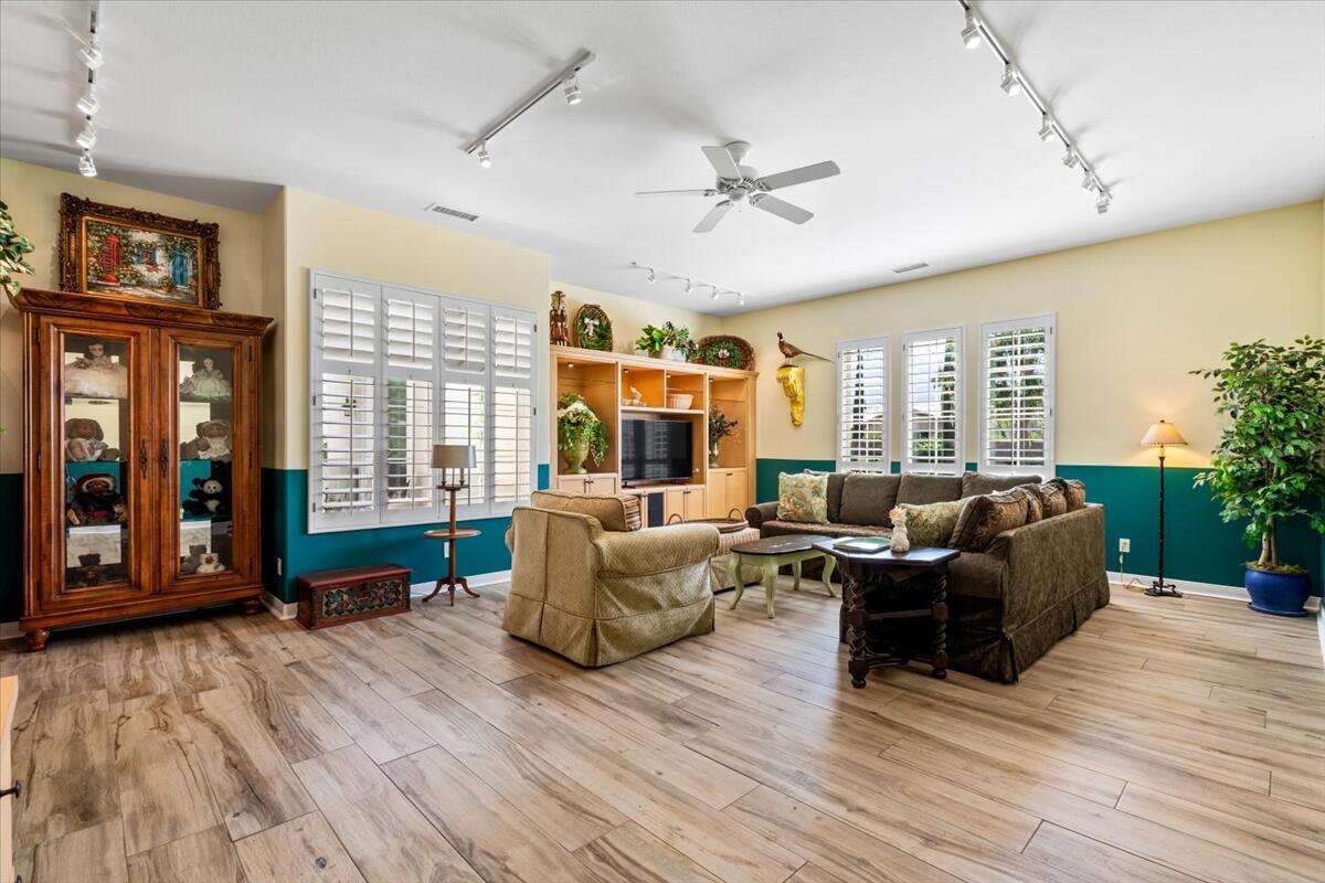 81836 Bowstring Circle La Quinta, CA 92253 - Photo 19 of 56 a living room with furniture and wooden floor