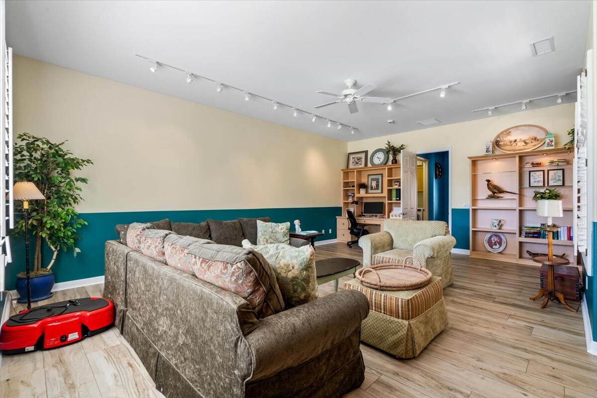 81836 Bowstring Circle La Quinta, CA 92253 - Photo 20 of 56 a living room with furniture and flowers