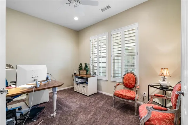 a bedroom with a bed couch and a window