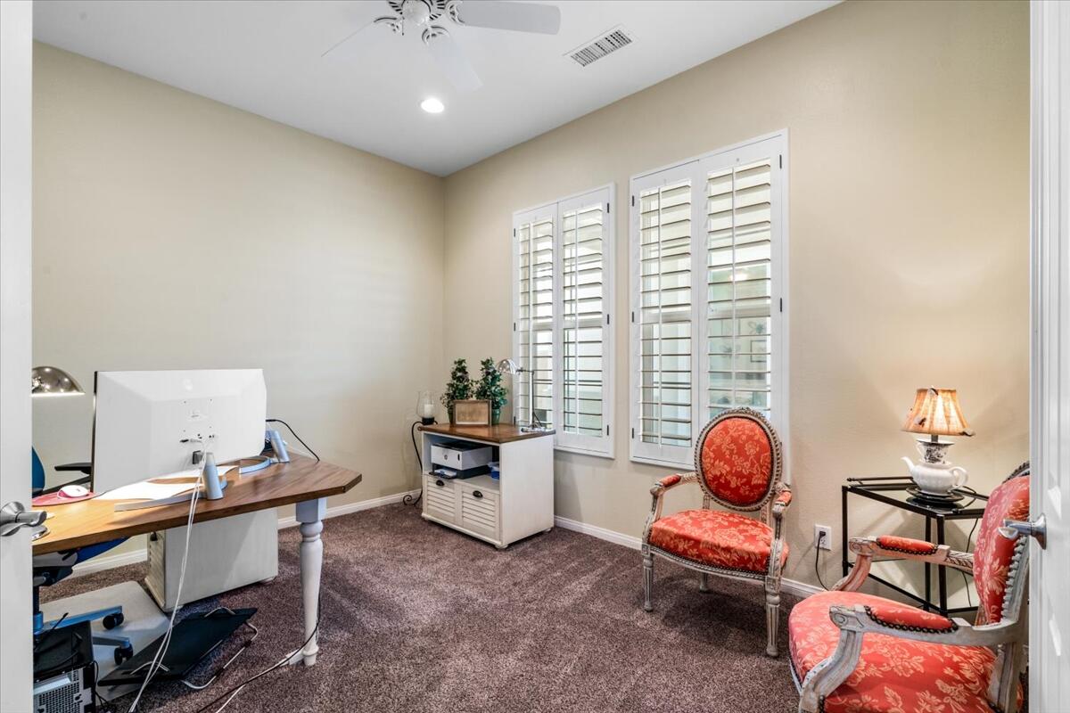 81836 Bowstring Circle La Quinta, CA 92253 - Photo 22 of 56 a view of a workspace with furniture and a window