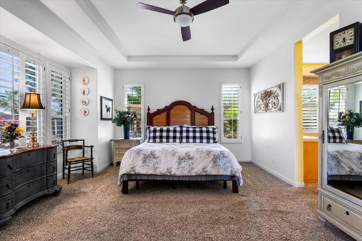 81836 Bowstring Circle La Quinta, CA 92253 - Photo 24 of 56 a bedroom with a bed a dresser and next to a window