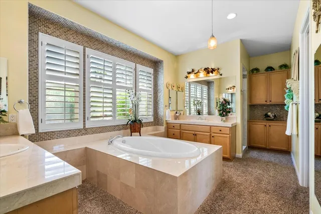 a view of a patio with table and chairs and potted plants