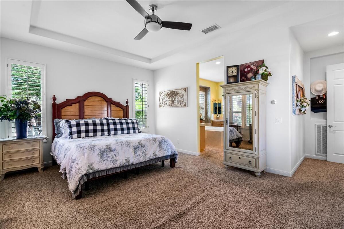 81836 Bowstring Circle La Quinta, CA 92253 - Photo 25 of 56 a bedroom with a bed couch and a window