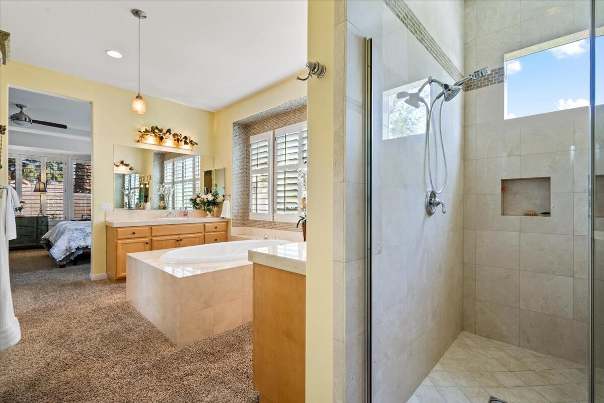 81836 Bowstring Circle La Quinta, CA 92253 - Photo 27 of 56 a spacious bathroom with a tub a mirror and a shower