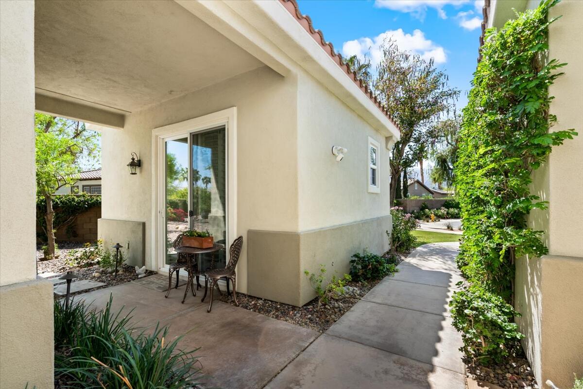 81836 Bowstring Circle La Quinta, CA 92253 - Photo 28 of 55 a view of a patio with table and chairs and potted plants