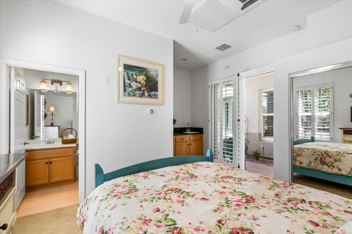 81836 Bowstring Circle La Quinta, CA 92253 - Photo 31 of 56 a bedroom with a bed and a couch