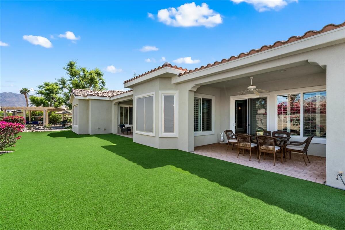 81836 Bowstring Circle La Quinta, CA 92253 - Photo 36 of 56 a view of a house with a backyard and chairs