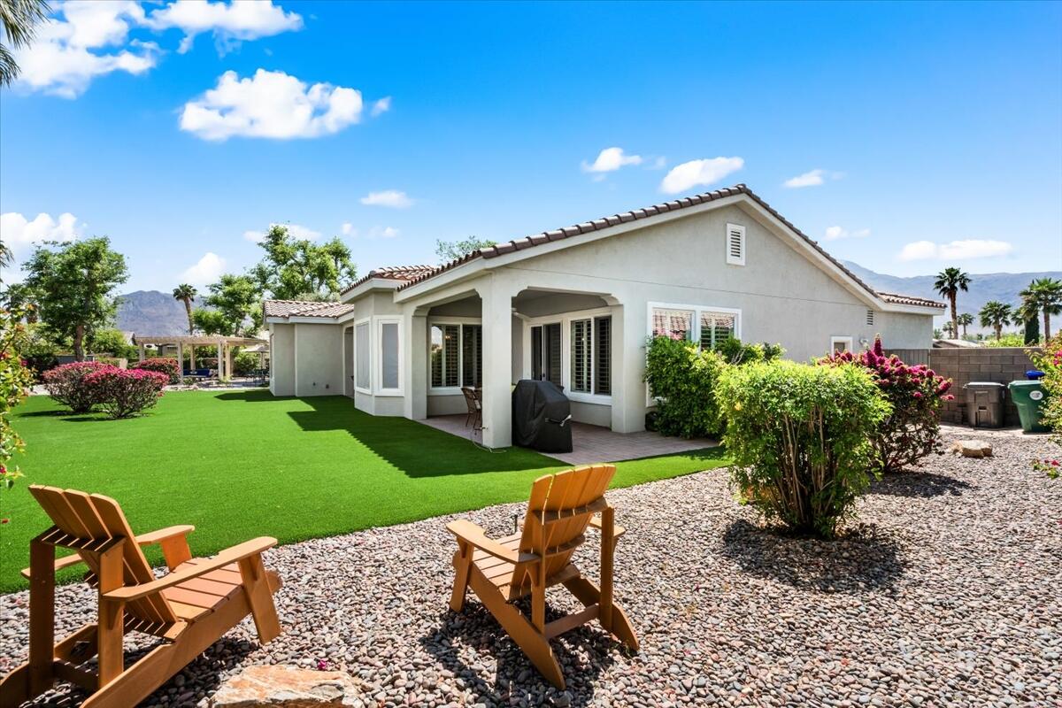 81836 Bowstring Circle La Quinta, CA 92253 - Photo 36 of 55 a view of a house with backyard sitting area and garden