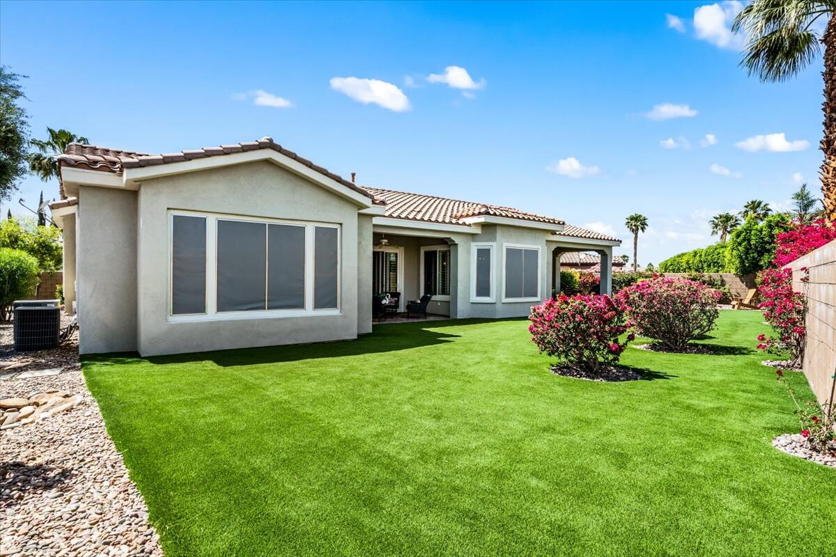 81836 Bowstring Circle La Quinta, CA 92253 - Photo 41 of 56 a front view of a house with a garden