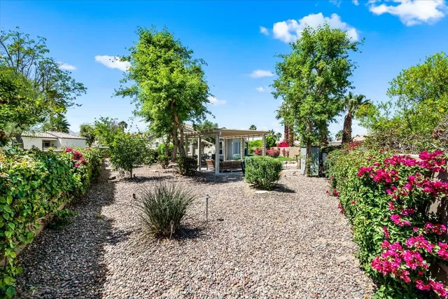 a aerial view of a house with swimming pool and furniture