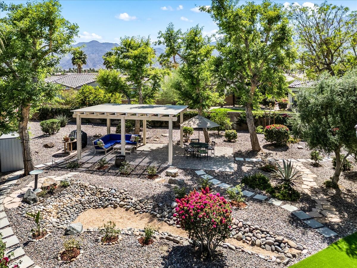 81836 Bowstring Circle La Quinta, CA 92253 - Photo 47 of 56 a view of a patio with chair and tables