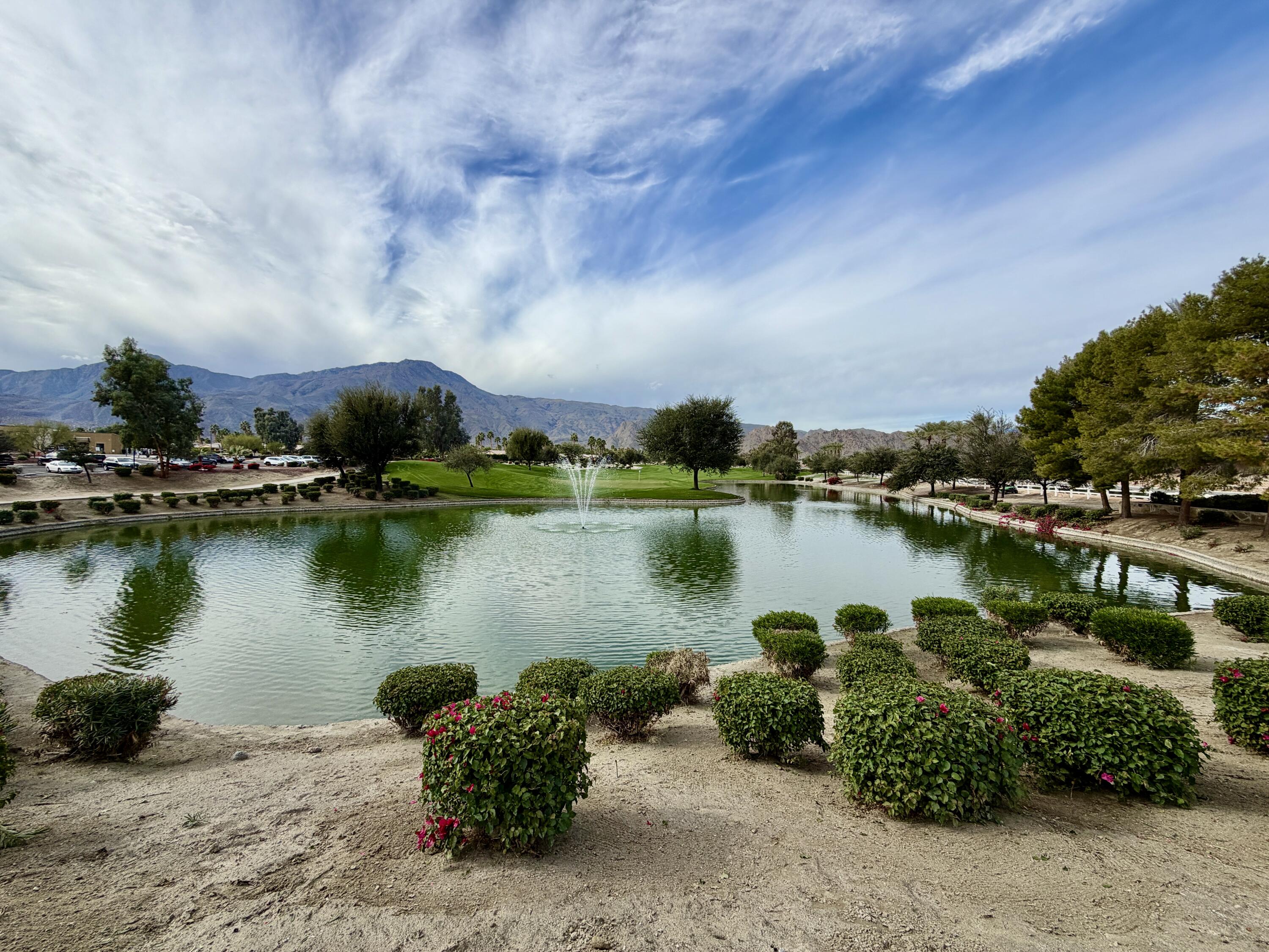 81836 Bowstring Circle La Quinta, CA 92253 - Photo 55 of 56 a view of a lake with houses in the back