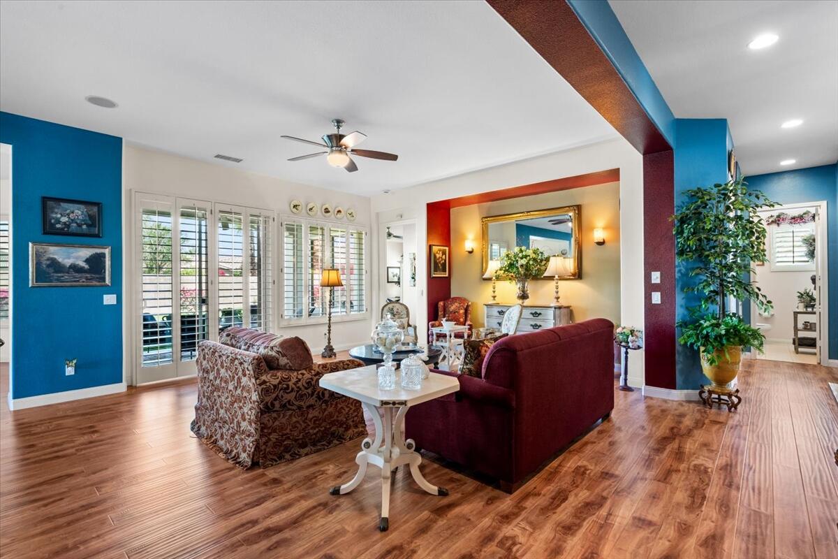 81836 Bowstring Circle La Quinta, CA 92253 - Photo 10 of 56 a living room with furniture large window and wooden floor