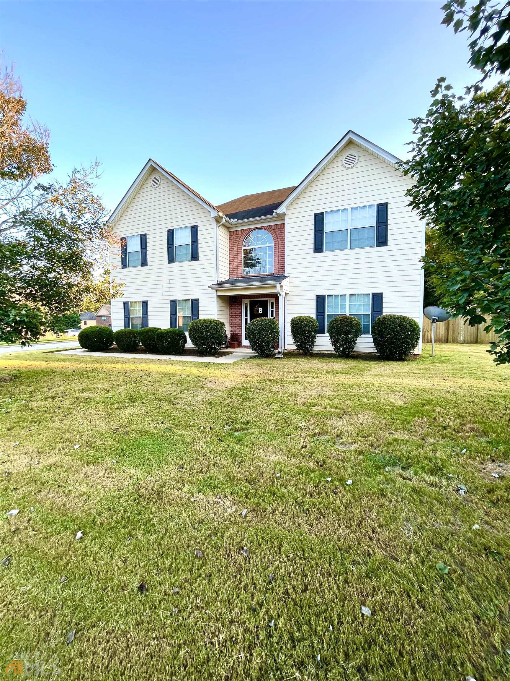 8114 Maple Street Southwest Covington, GA 30014 - Photo 1 of 1 a view of a house with a yard and sitting area