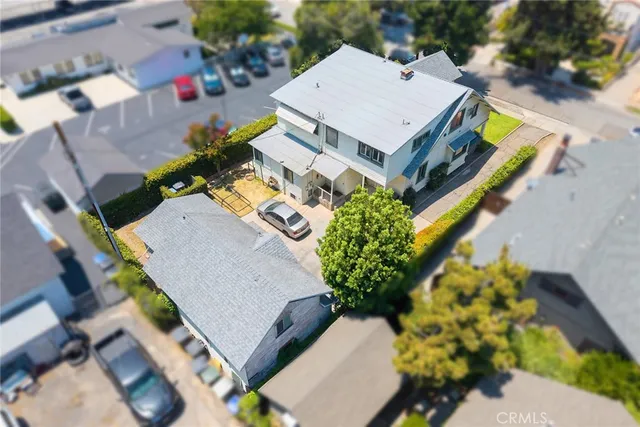 an aerial view of a house with a swimming pool