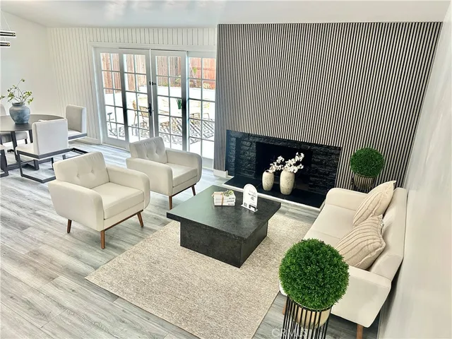 a living room with furniture rug and window