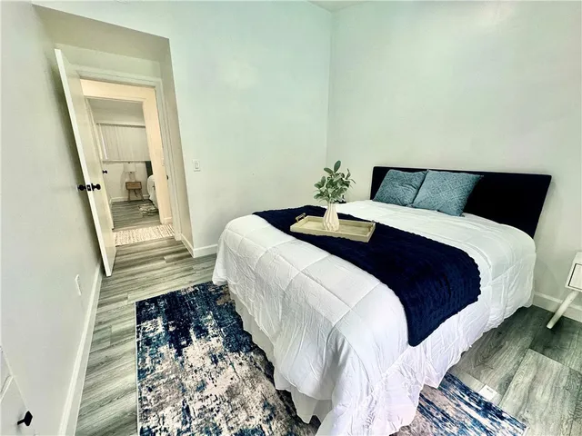 a bedroom with a large bed and a window