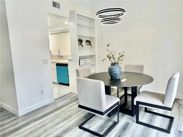 a kitchen with a refrigerator and a sink
