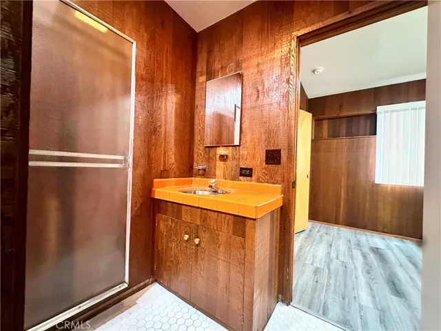 a bathroom with a sink and a mirror