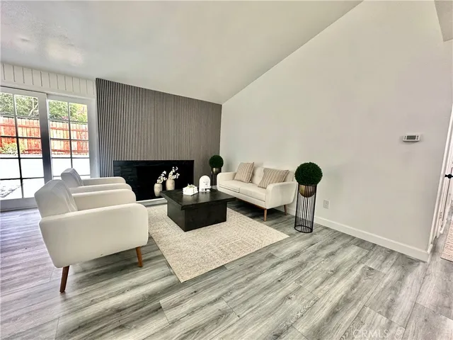 a living room with furniture rug and window