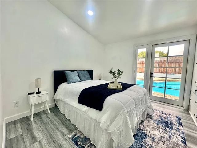 a view of a house with pool and sitting area