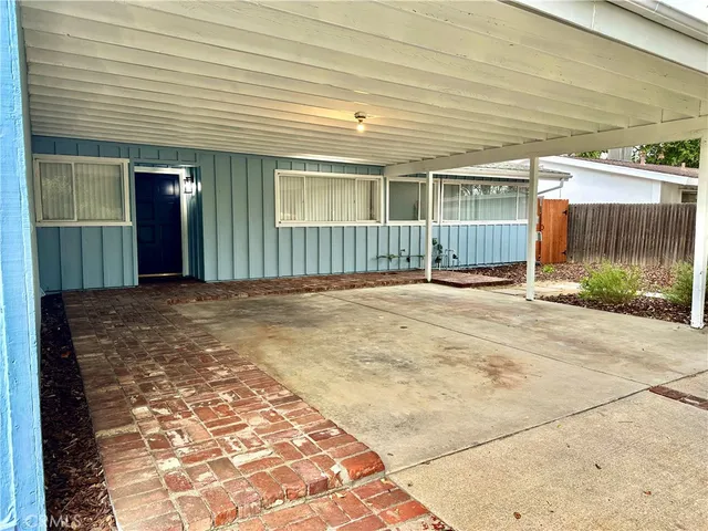 a view of a workspace room with furniture and a potted plant