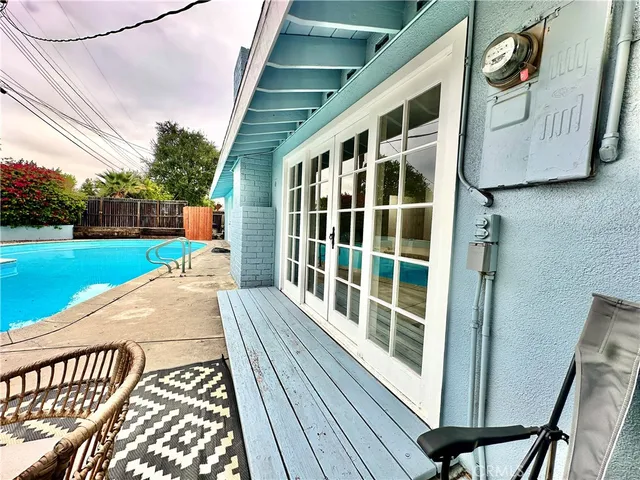 a view of a patio with a chairs and table