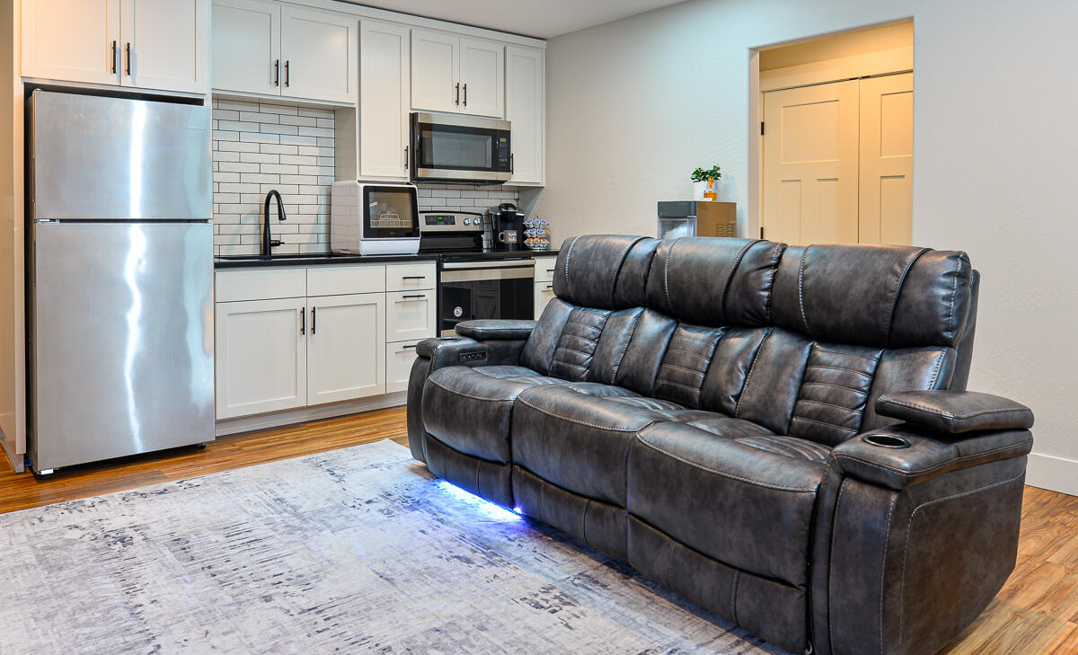 1029 Brandon Way Phoenix, OR 97535 - Photo 45 of 75 a living room with a couch and a flat screen tv